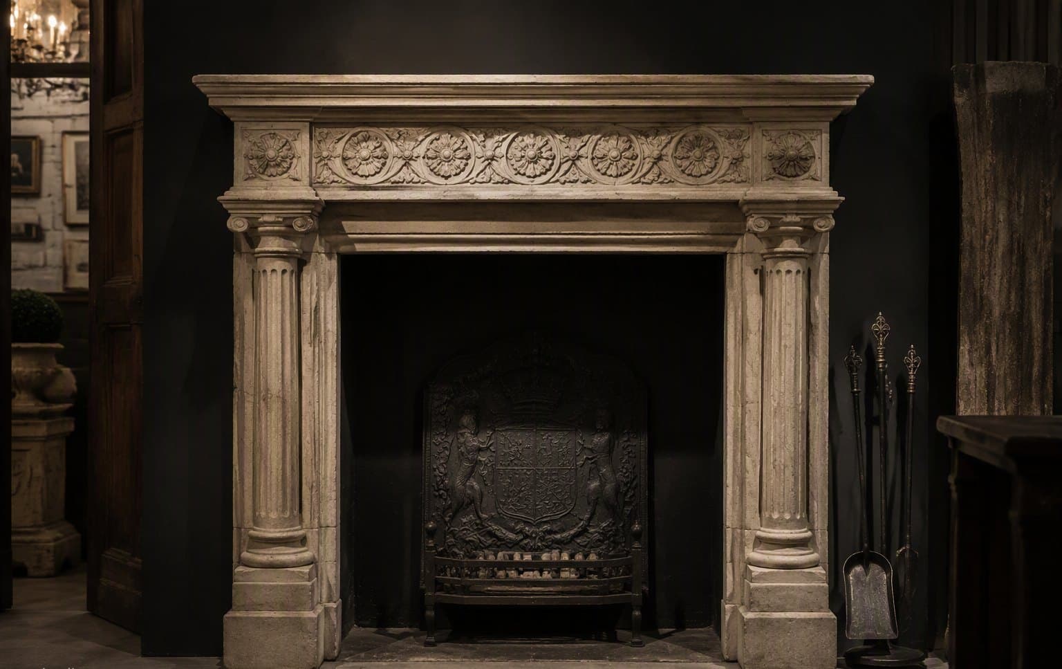 A carved Georgian stone fireplace in the showroom